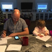 Gabby and Daddy writing cards